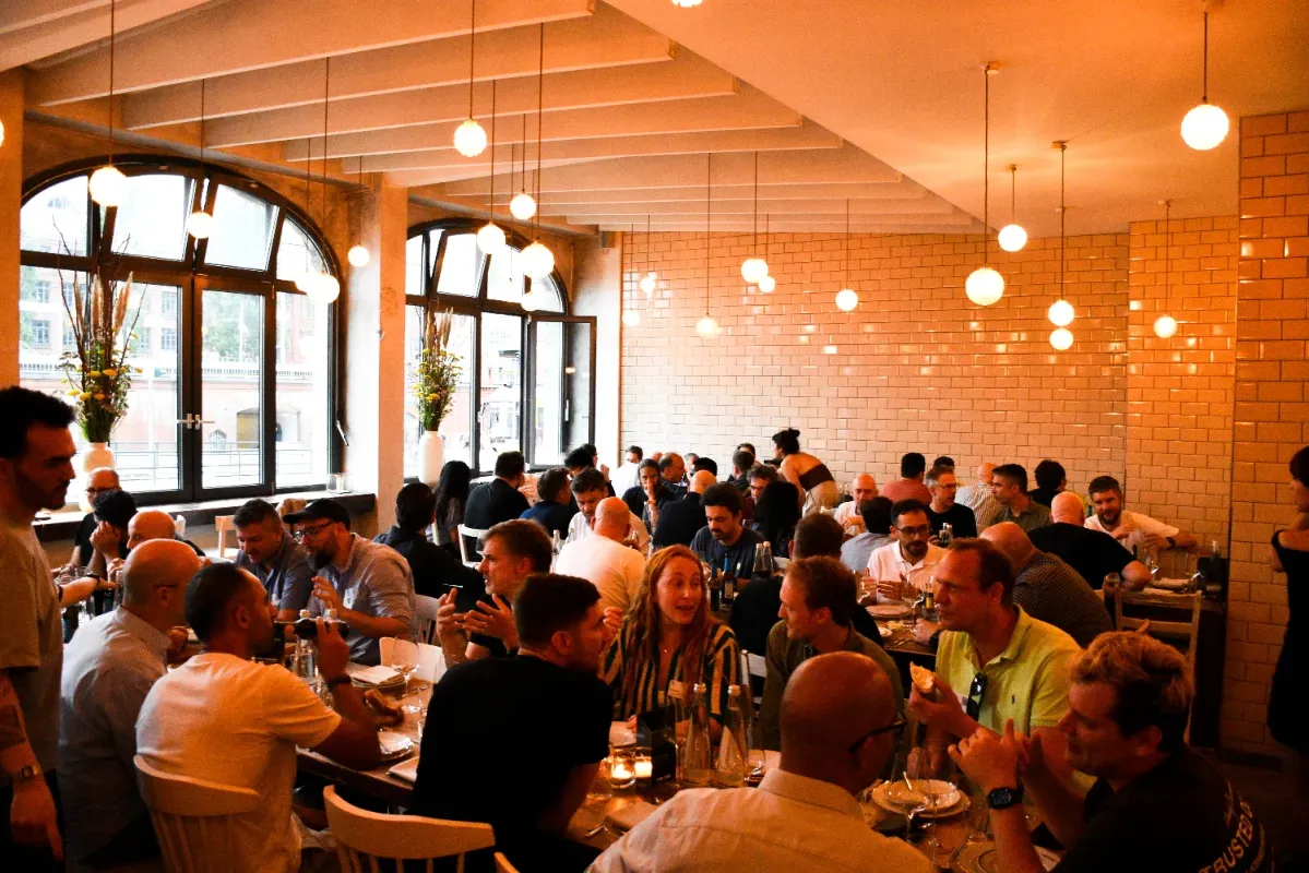 CTOs talking around a long dinner table